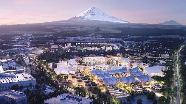 Monte Fuji. Esta es la visión urbana del futuro planteada por la empresa automovilística Toyota, que se define como «un ecosistema tecnológico y social único en el mundo». El histriónico arquitecto danés Bjarke Ingels está a cargo del diseño de esta «ciudad entrelazada» que ocupará 70 hectáreas situadas al pie del Monte Fuji y será totalmente sostenible. Su propósito será «poner a prueba en un entorno real» la convivencia entre el medioambiente, la inteligencia artificial y la vida humana para así desarrollar las tecnologías del futuro.