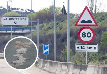 Señalización de la nueva velocidad máximas en la Autovía del Duero y uno de los baches de la carretera.