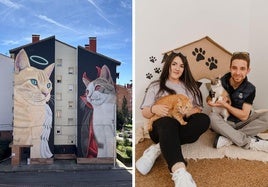 Mural 'Santín y Draculina' en Guardo y su autor, Manuel García, junto a Sandra y sus gatos.