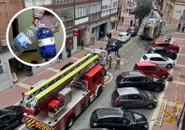 Presencia de los Bomberos de Valladolid durante el incendio en la calle Imperial. En el detalle, una vecina del inmueble baja con dos garrafas a por agua.