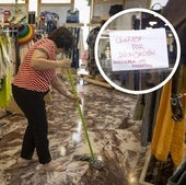 Labores de limpieza en la tienda Cascanueces de Portugalete y cartel de 'cerrado por inundación' en otro comercio afectado del centro.