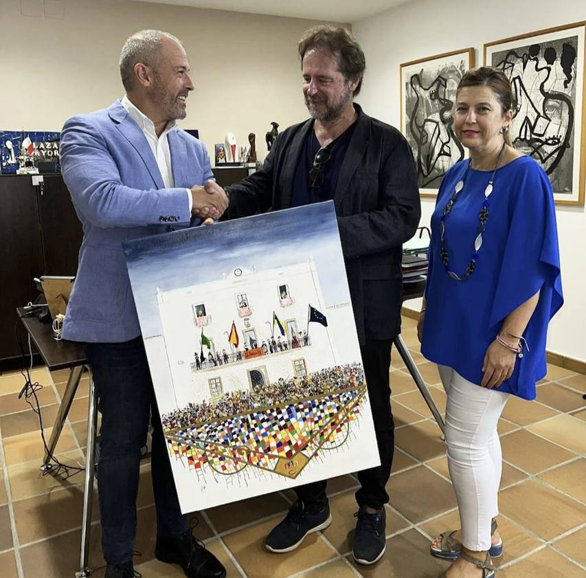 Imagen principal - Víctor González Barrera dona una pintura original al Ayuntamiento de Malpartida de Cáceres
