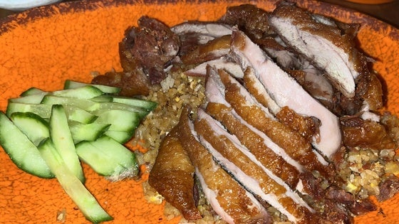 Un poco de pato con arroz en Noodle Rest o comer de cine