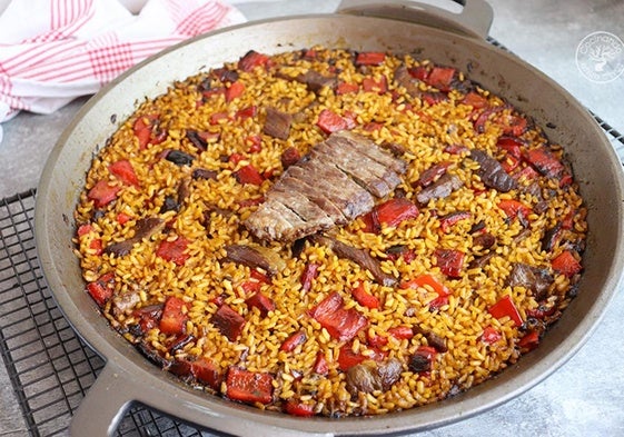 Arroz con presa ibérica y pimientos rojos