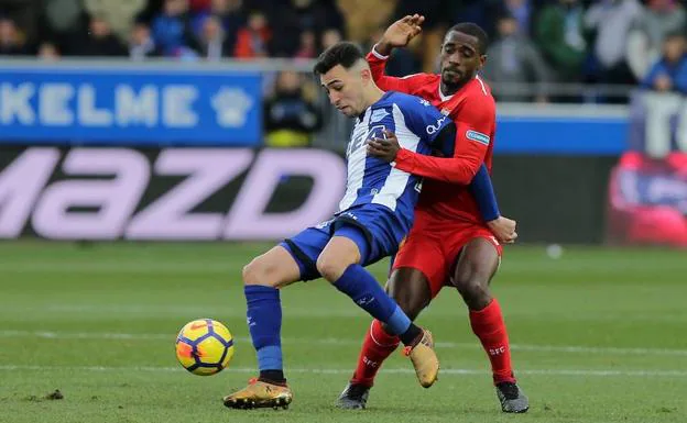 Munir El-Haddadi y Lionel Carole.