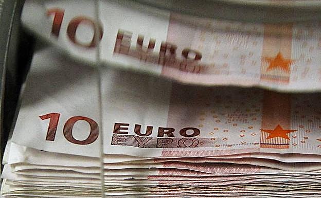 Una máquina cuenta billes de 10 euros.