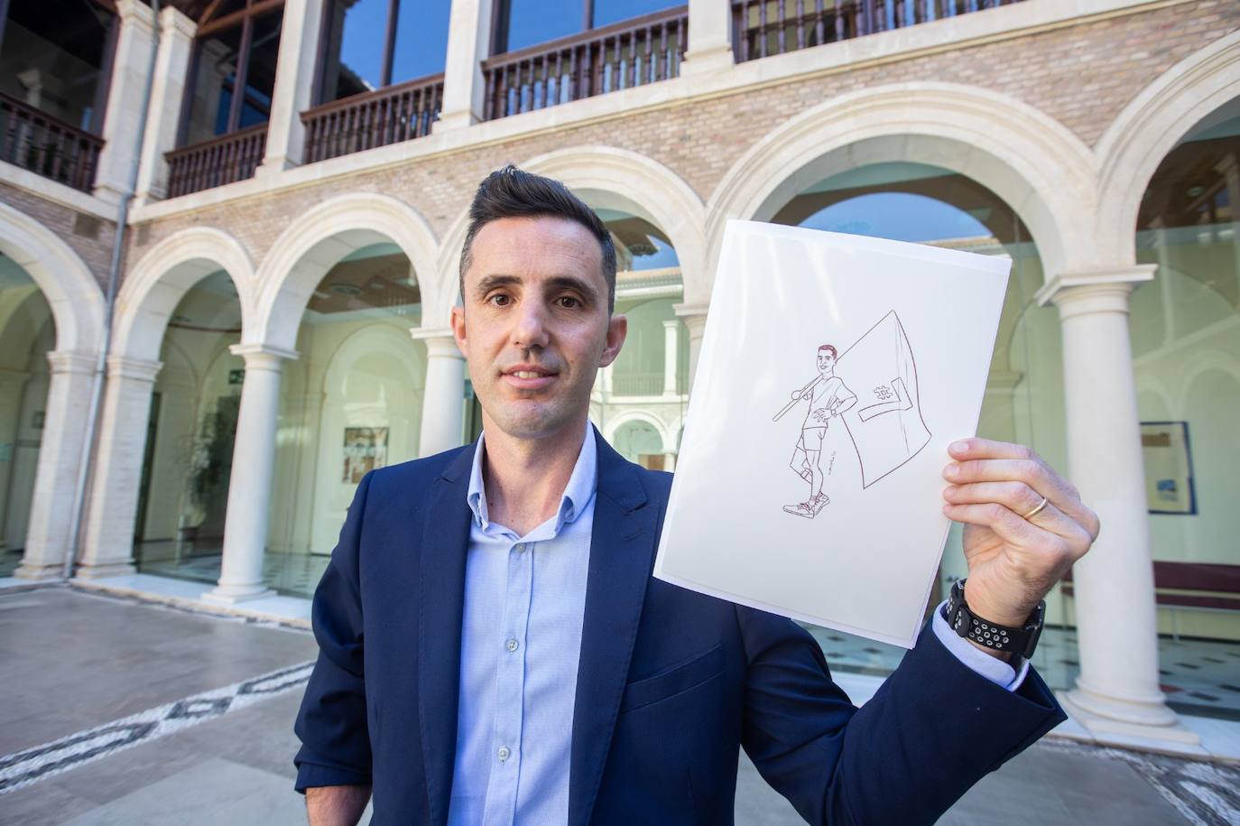 El palista paralímpico José Manuel Ruiz, con la bandera por sus séptimos Juegos. 