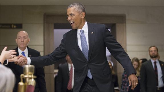 El presidente de los Estados Unidos, Barack Obama (c).