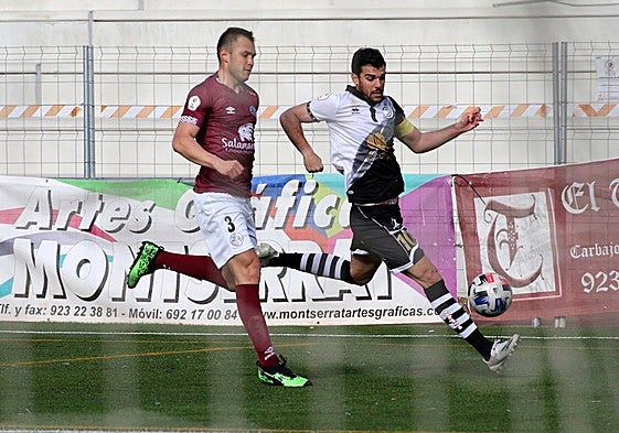 Kristian Álvarez y Carlos de la Nava, en el anterior derbi en el Reina Sofía.