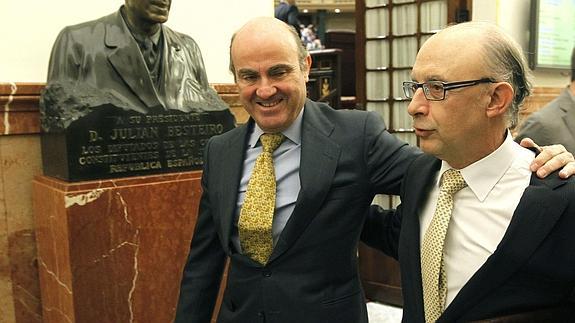 Luis de Guindos y Cristóbal Montoro.