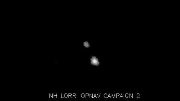Imagen de Plutón y de su luna Caronte tomada por la nave New Horizons. 
