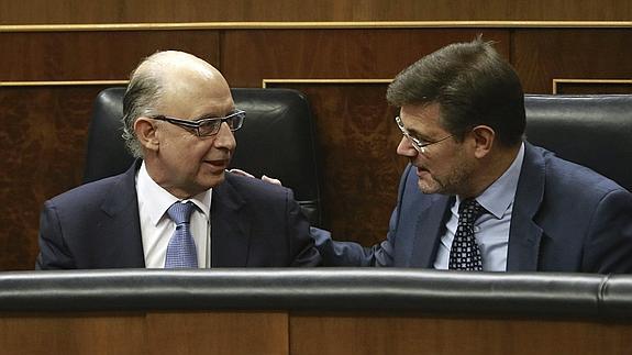 Cristóbal Montoro y Rafael Catalá. 