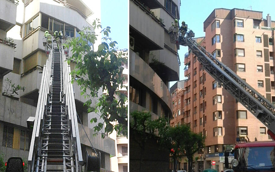 Intervención de los bomberos con la escalera telescópica en el edificio 'Torre blanca' de Logroño. 