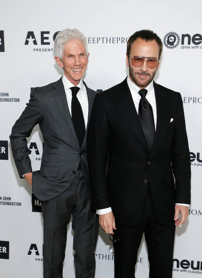 Tom Ford (d) y su marido Richard Buckley.