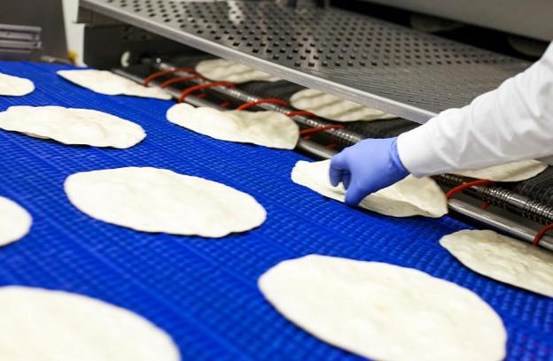 Máquina de producción de tortillas mexicanas de la empresa valenciana Delibreads. 