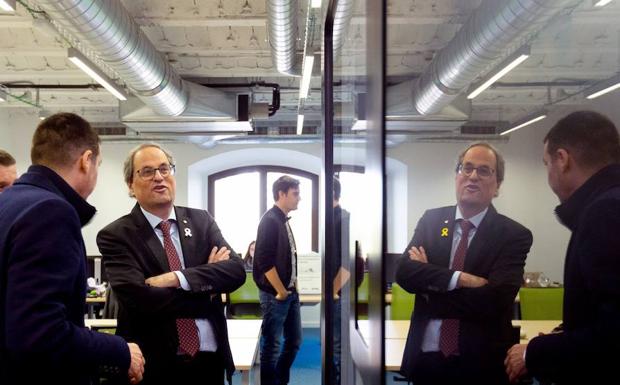 El presidente de la Generalitat, Quim Torra, junto al presidente de la asociación Barcelona Tech City, Miguel Vicente (i). 