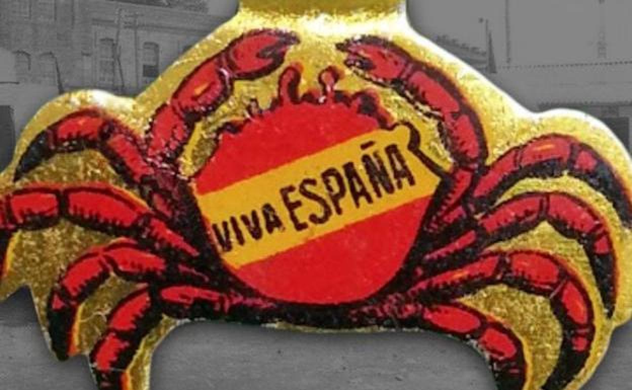 Insignia metálica con centollo y lema de «Viva España»