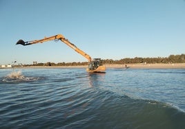 Una excavadora trabaja para acabar con los agujeros en el fondo marino.