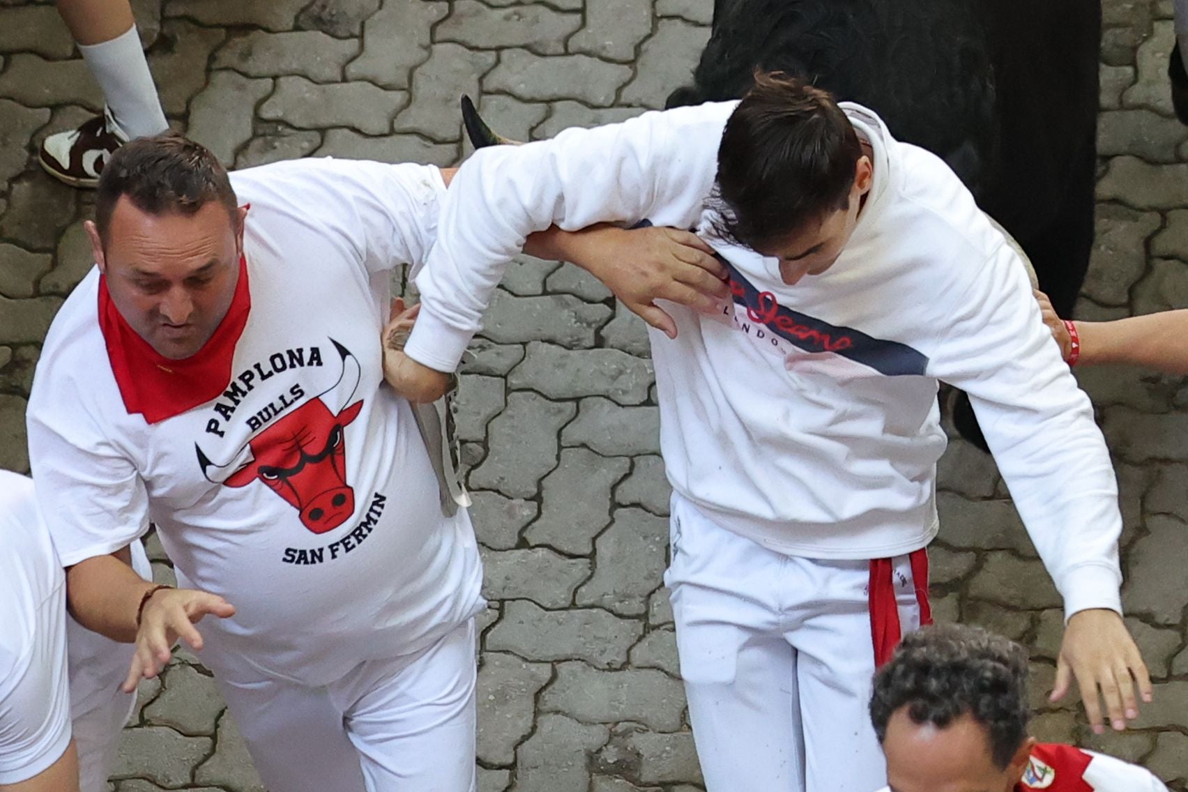 FOTOS | Séptimo encierro de San Fermín 2025