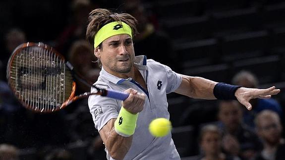 Ferrer golpea la pelota ante Dolgopolov. 