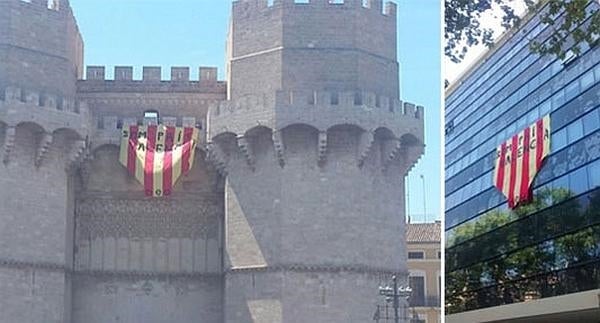 Cuelgan el Penó de la Conquesta en la Universitat y en las Torres de Serranos con el lema 'Som País Valencià'