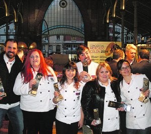 Promesas. Algunos de los premiados en el Mercado de Colón. ::                             G. CONFITEROS