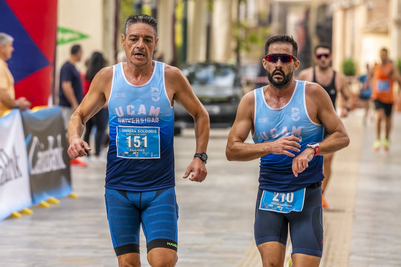 La I Carrera Solidaria Alfonso X de la Feria de Murcia, en imágenes