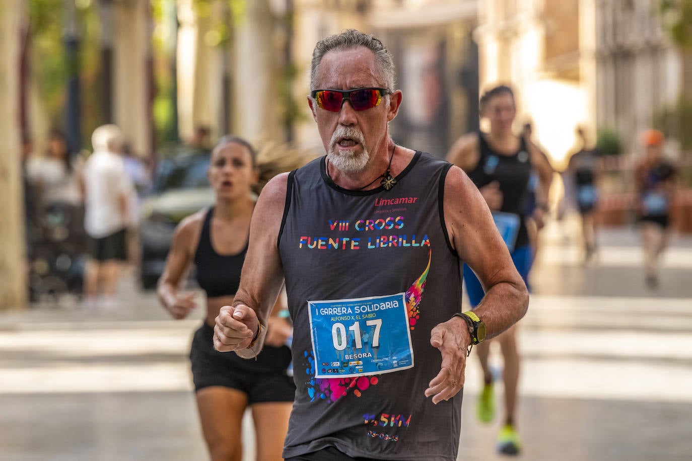 La I Carrera Solidaria Alfonso X de la Feria de Murcia, en imágenes