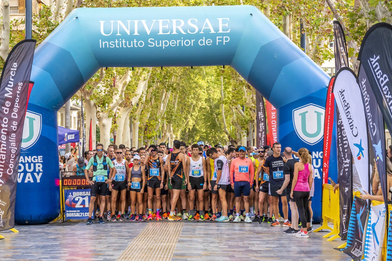 La I Carrera Solidaria Alfonso X de la Feria de Murcia, en imágenes