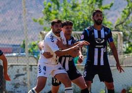 Los jugadores del Racing Cartagena y el UCAM durante el parido en la Ciudad Deportiva