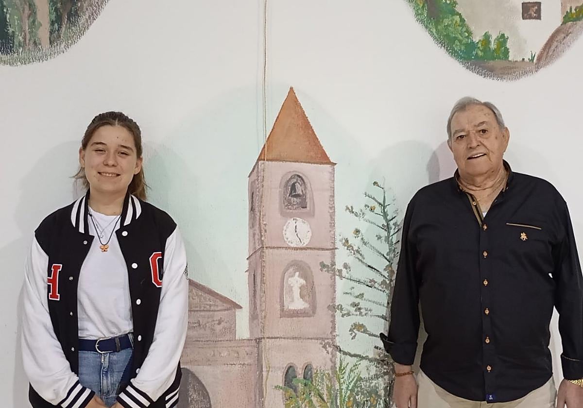 Marina y Andrés Marchán, con un dibujo de la torre parroquial de La Aljorra al fondo.