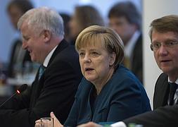 Angela Merkel, durante las negociaciones. / Johannes Eisele (Afp)