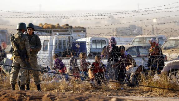 Refugiados sirios en la frontera turca.
