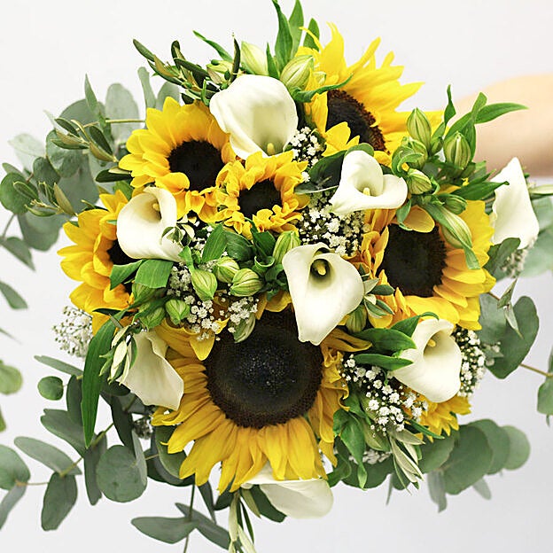 Propuesta de ramo de novia de Colvin para una boda en la playa.