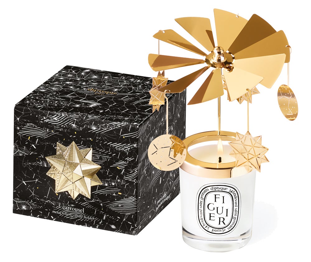 Carrusel Constelación (40 €) sobre la vela Figuier de Diptyque.