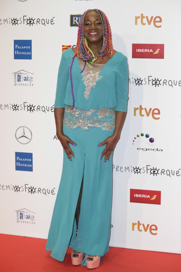 Lucrecia, inconfundible con un vestido verde agua y gasa bordada.