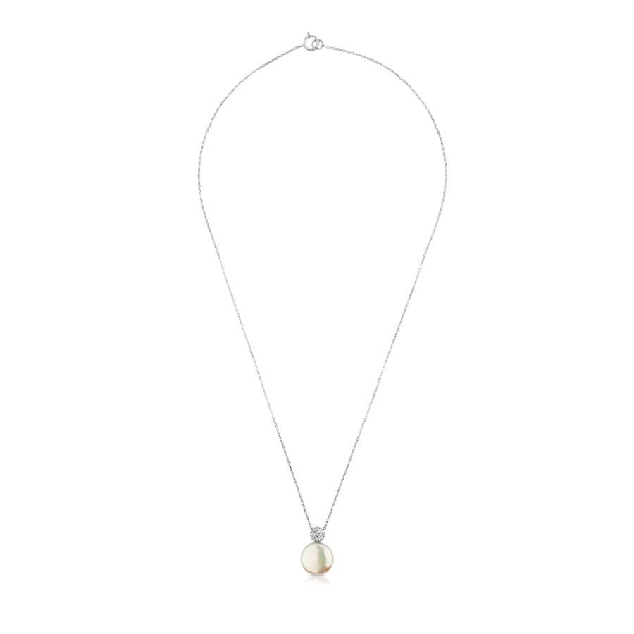 Si el look es sencillo y lo permite, una gargatilla, como esta de Tous en oro blanco de 18kt, perla y diamantes, aportará elegancia