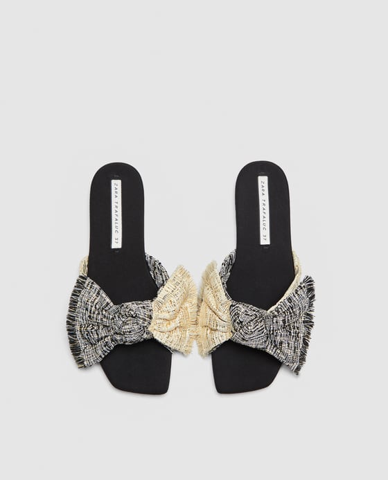 alas de tejido tweed con lazo de Zara (19,95 euros)