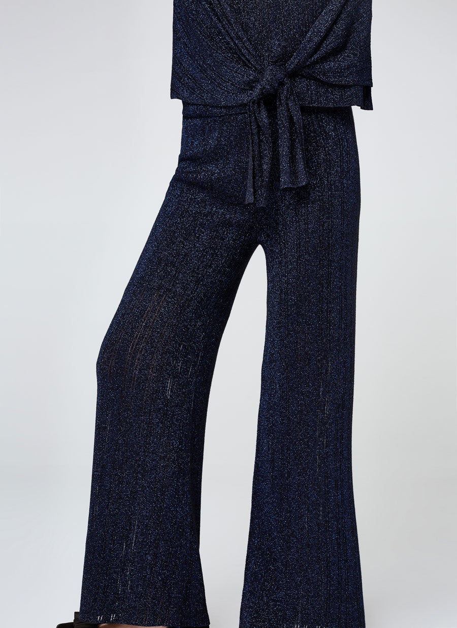 Pantalón de canalé fluido con purpurina de Uterqüe: 39,95 euros.