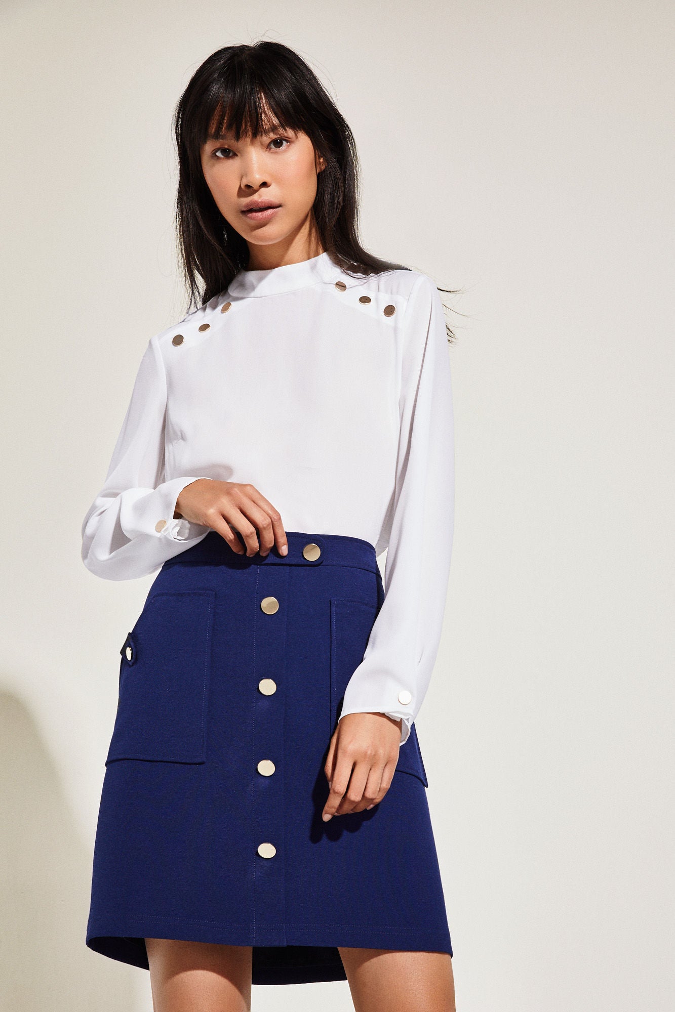 Falda con doble tejido y botones de Cortefiel: 59,99 euros.