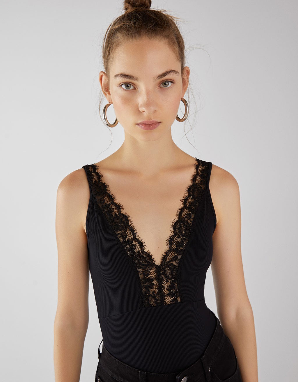 Body de tirantes con puntilla de Bershka: 17,99 euros.