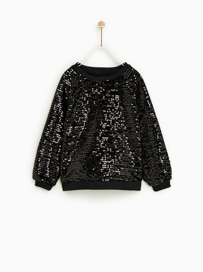 Jersey ancho en color negro con detalles de lentejuelas: 22,95€ en Zara Kids