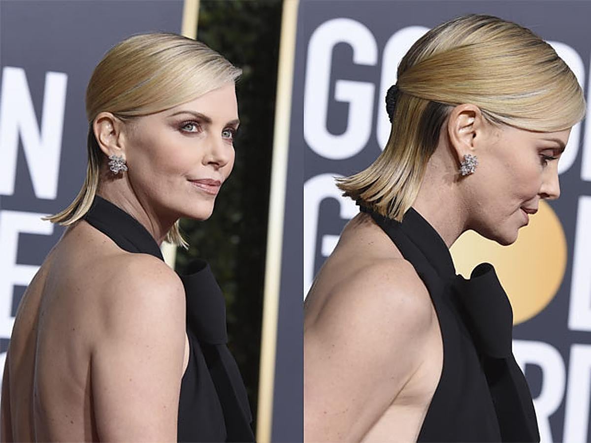 Charlize Theron prefirió decantarse por un peinado pulido con flequillo ladeado.