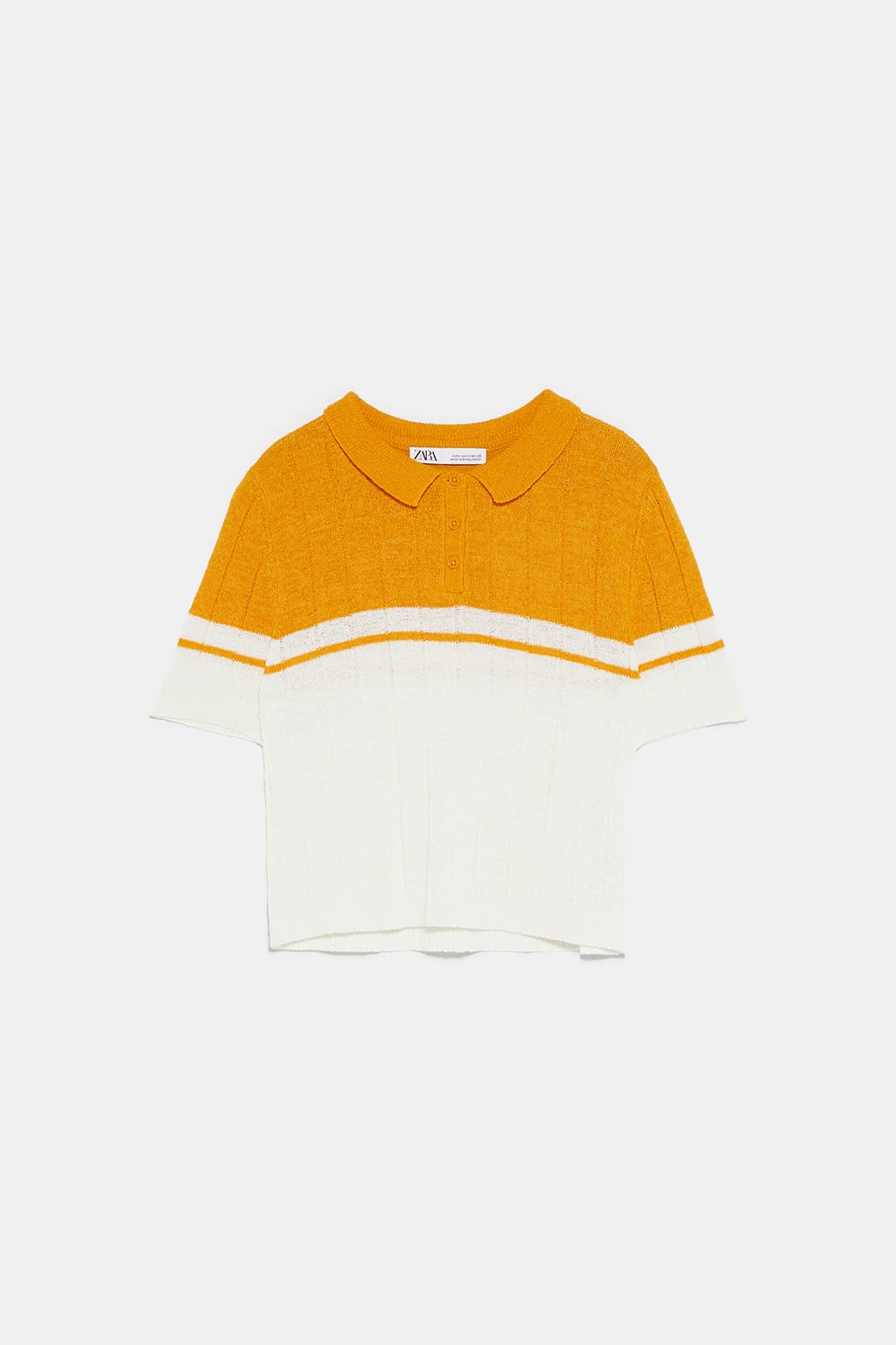 Polo de punto bicolor de Zara: 17,95 euros.
