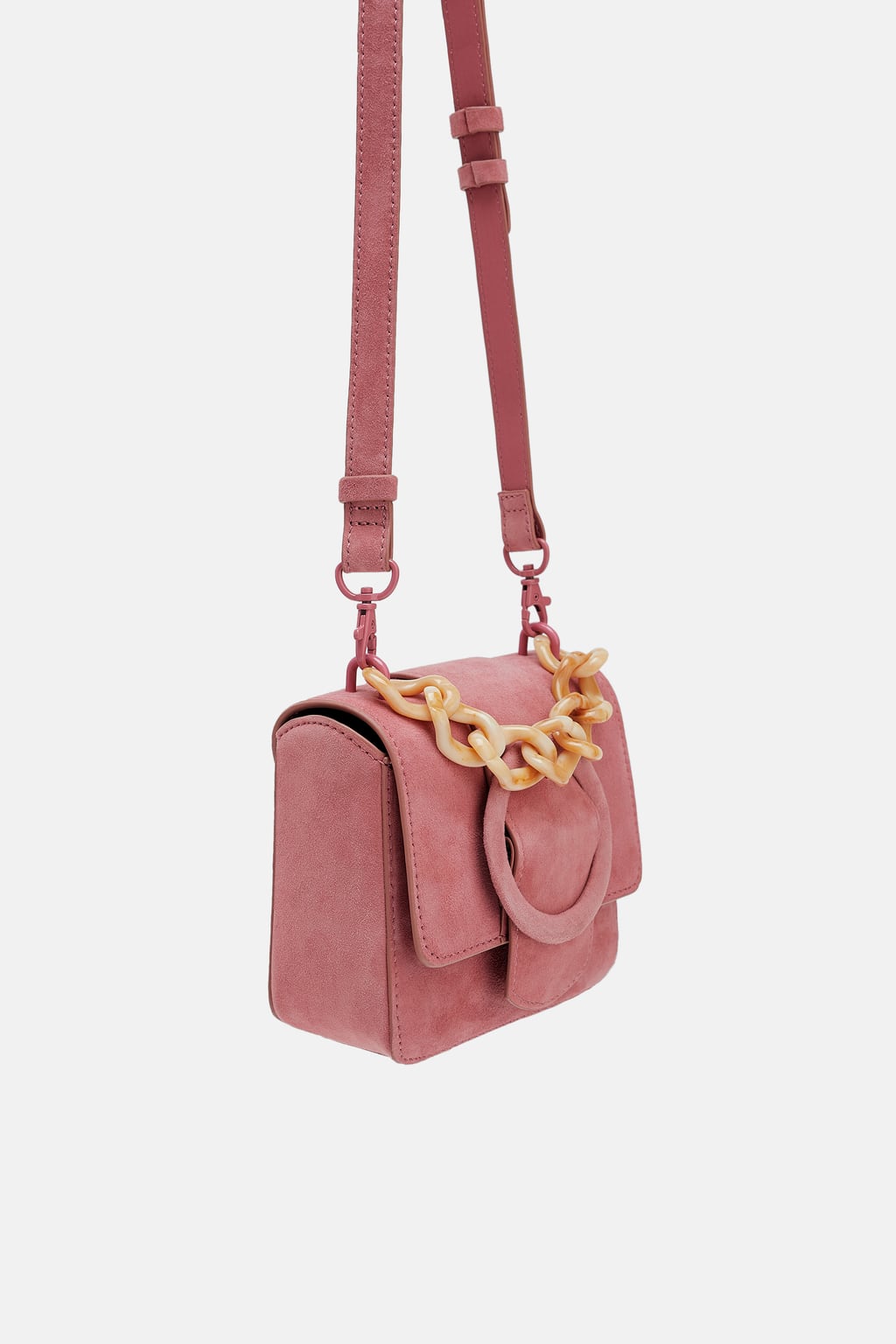 Mini bandolera de piel con asa: 39,95euros en Zara.