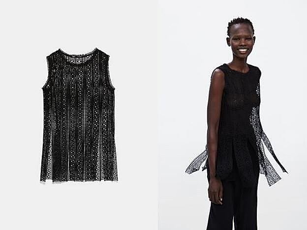 Top negro con aperturas de Zara: 22,95 euros.
