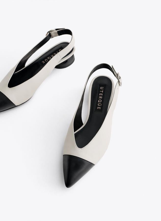 Estos zapatos bicolores destalonados de Uterqüe cuestan 79 euros, y harán que tus piernas parezcan más estilizadas.