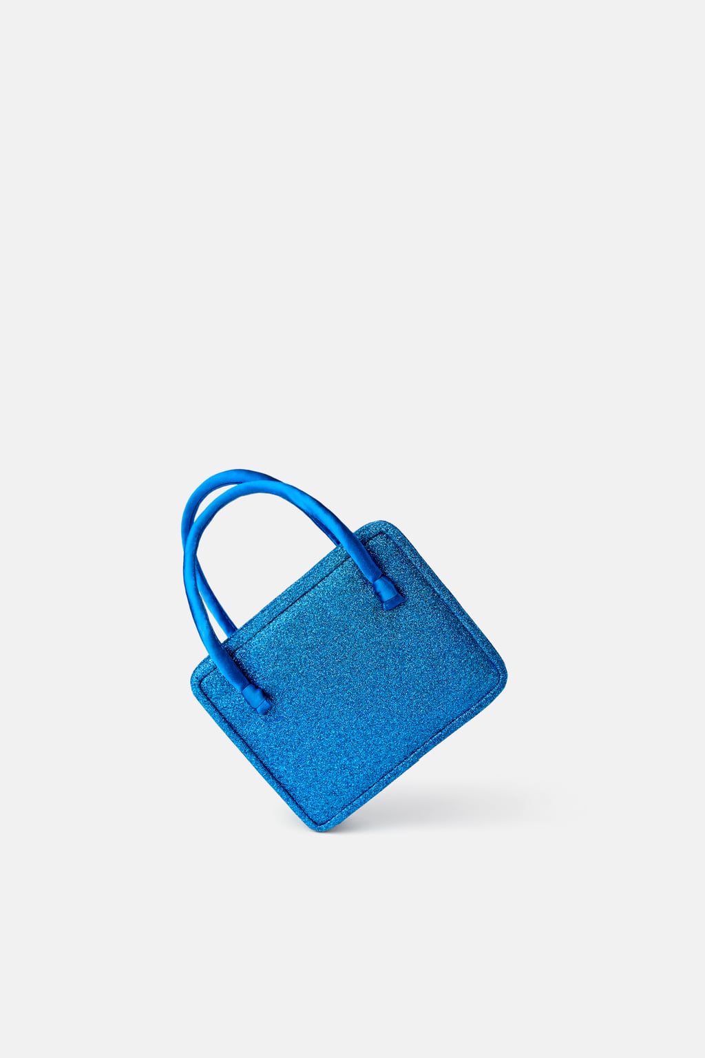 Mini bandolera glitter Blue Collection: 29,95 euros en Zara.