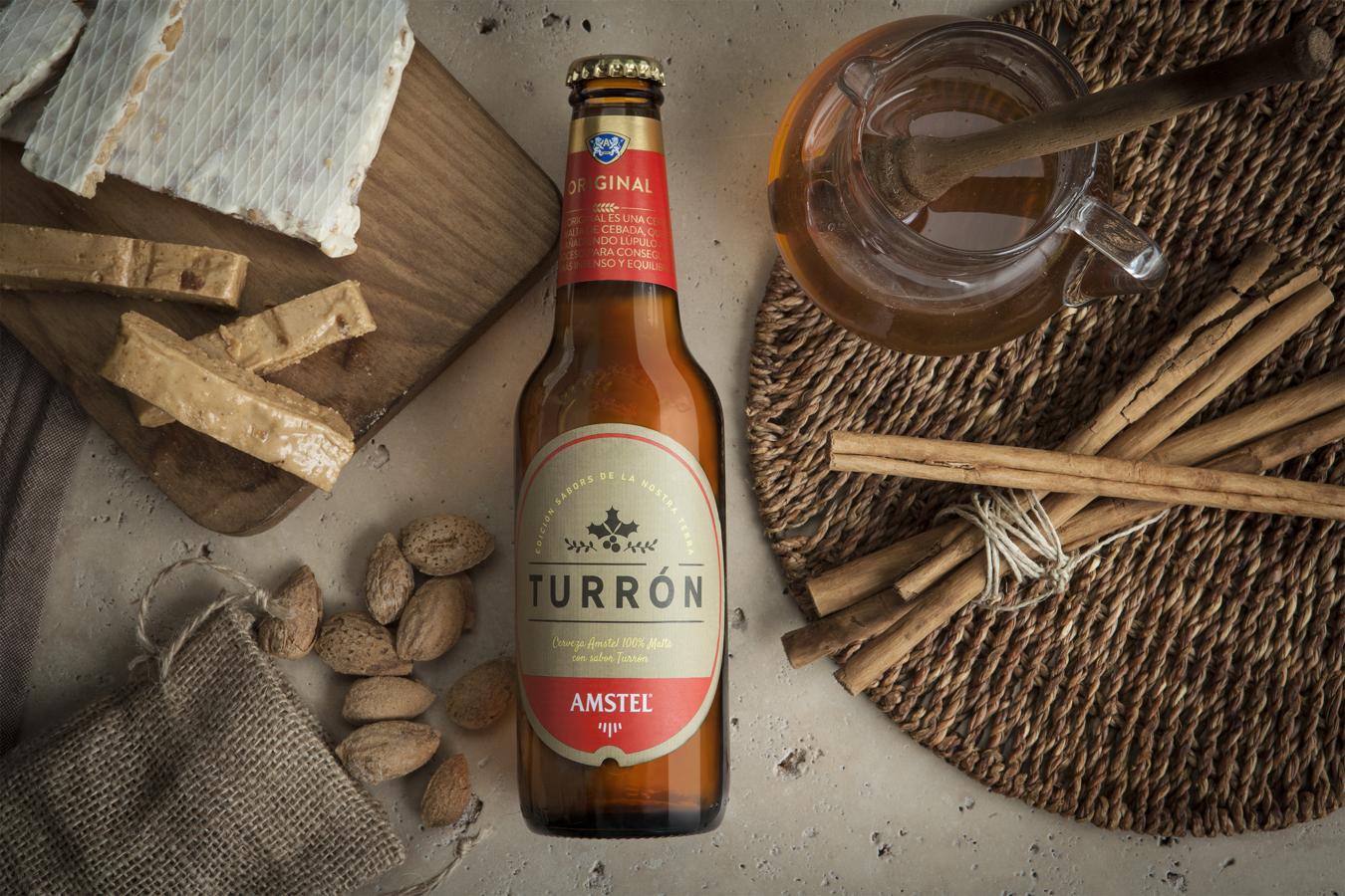 El bonus track de esta selección de turrones orginales no es un turrón... pero sí una cerveza edición limitada que combina la experiencia y el saber hacer de los maestros cerveceros valencianos de Amstel con los maestros turroneros de Jijona.