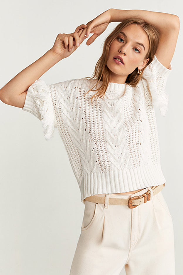 Un jersey de ochos de Mango, muy parecido al que lleva Jennifer Lopez.